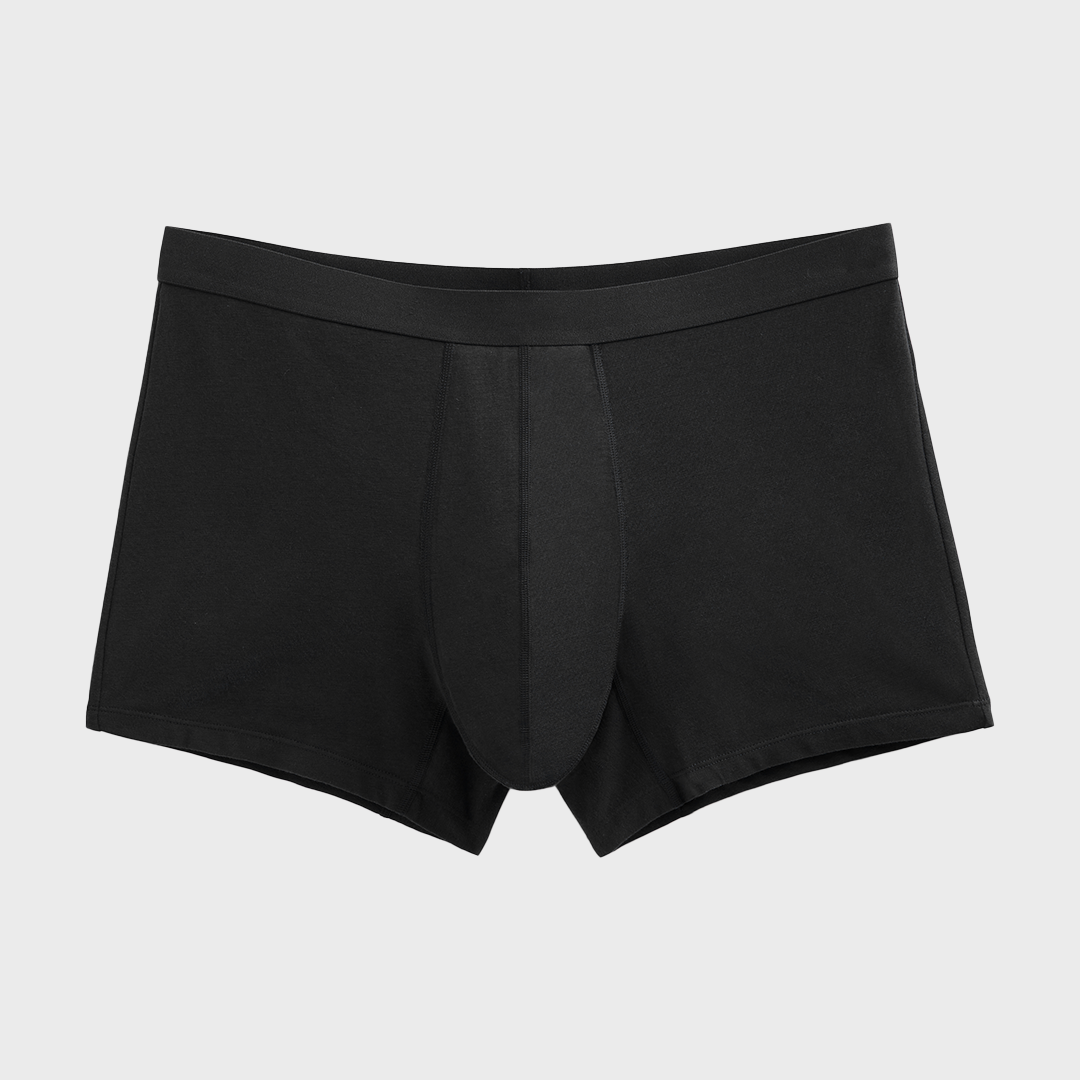 Boxer absorbant lavable homme, conçu pour l'incontinence légère, en coton biologique avec ceinture élastique, offrant discrétion et confort, semblable à un sous-vêtement classique.